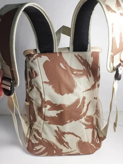 Desert camouflage cooler backpack held up by its shoulder straps