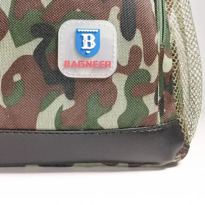 Close-up of the logo patch and mesh side pocket on the camouflage backpack