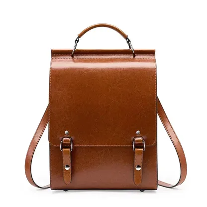 Women's vintage split leather backpack in tan brown, front view with flap and rivets
