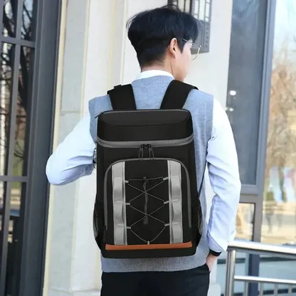 Man wearing the black insulated backpack, seen from behind