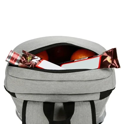 Top opening of the light grey backpack filled with fruit and snacks