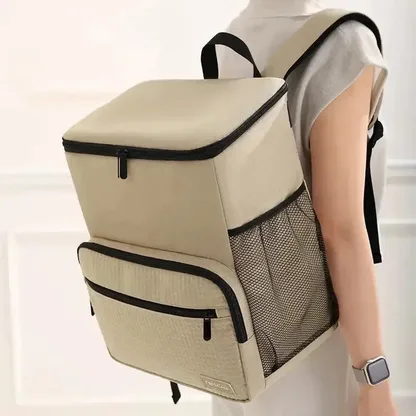 Woman wearing the sand-coloured cooler backpack on her back