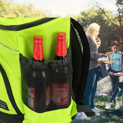 Two bottles in the mesh side pocket of the neon green backpack at a picnic