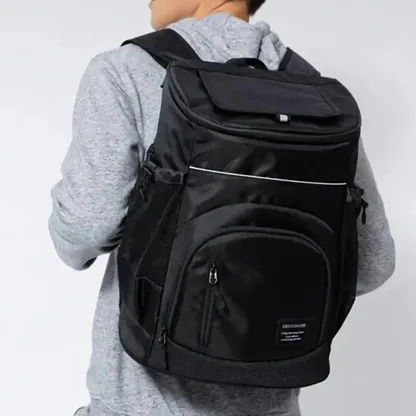Man wearing the black insulated backpack on both shoulders