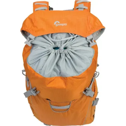 Orange backpack with its top flap open over a drawstring closure